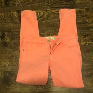 Neon coral skinny jeans